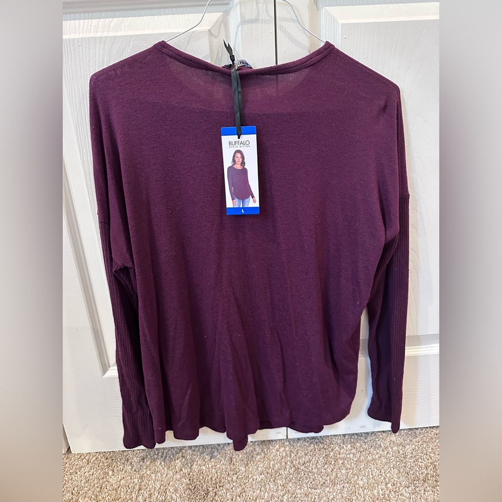 Women’s long sleeve, marron shirt.